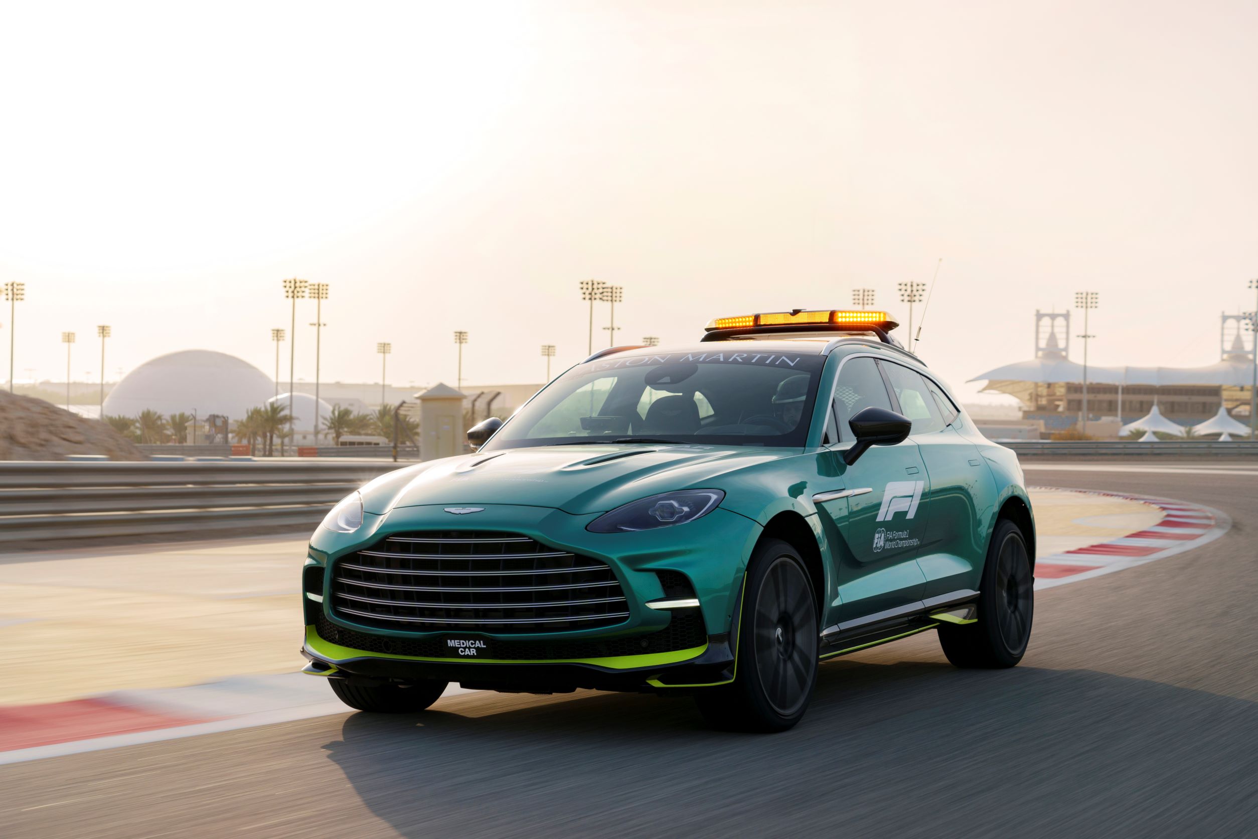 A front three quarter motion shot of the Aston Martin DBX707 F1 Medical Car