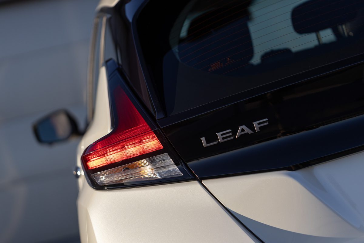 Close-up shot of the Leaf badge on a Gen 2  Nissan Leaf in white.