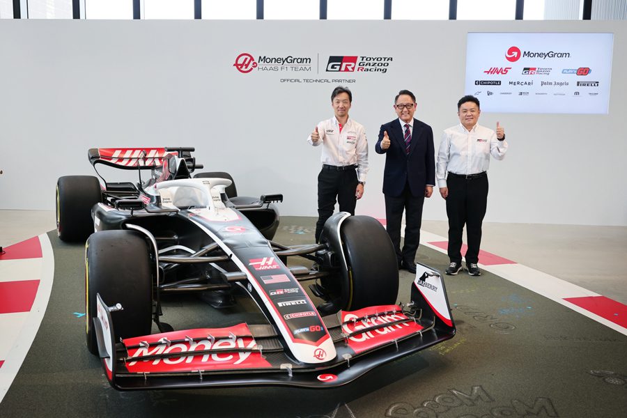 Akio Toyoda of Toyota Gazoo Racing and Ayao Komatsu of Haas F1 Team pictured next to the team's F1 car.