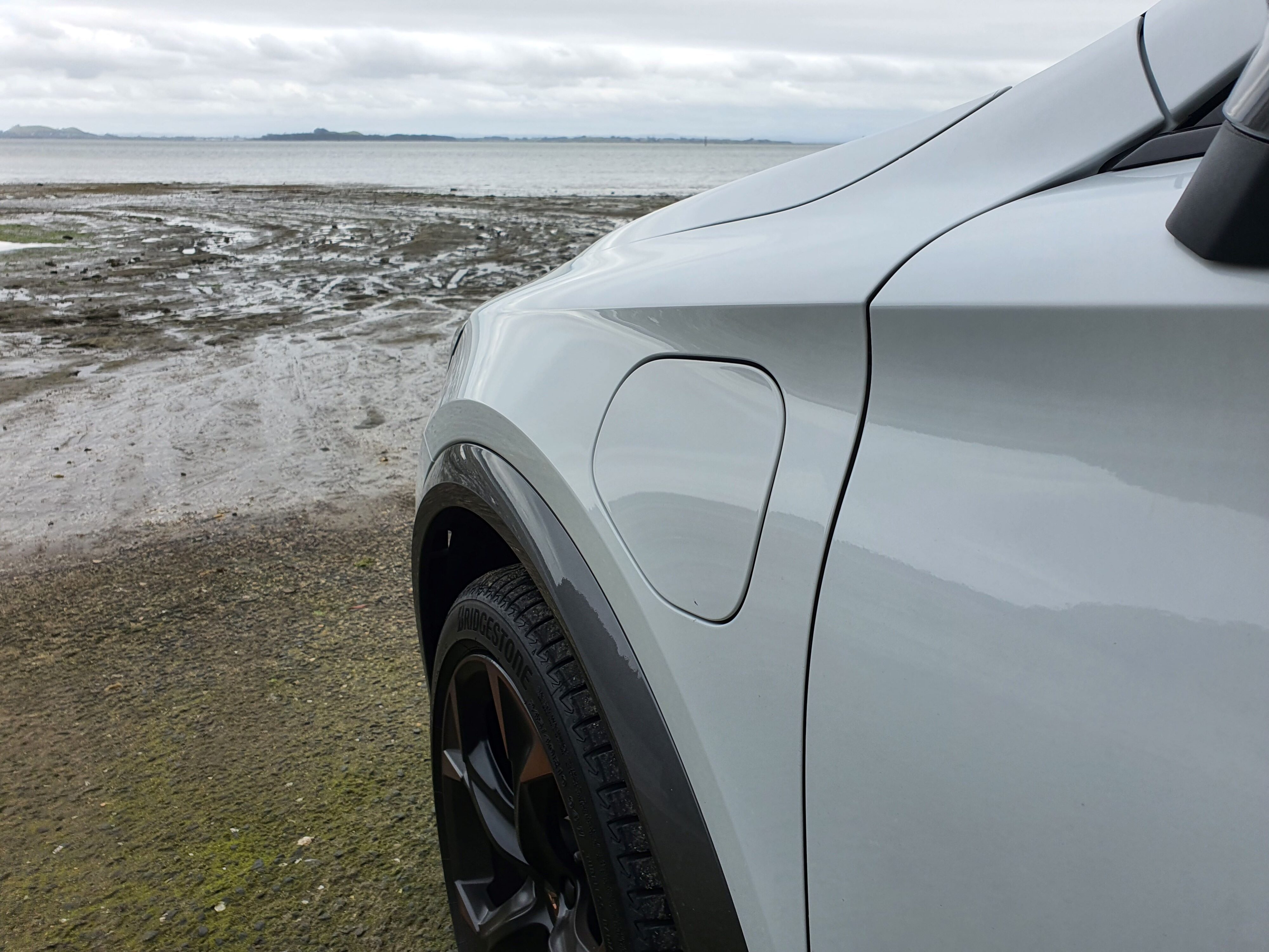 PHEV charging flap on the front left of a 2024 Cupra Formentor V e-Hybrid.