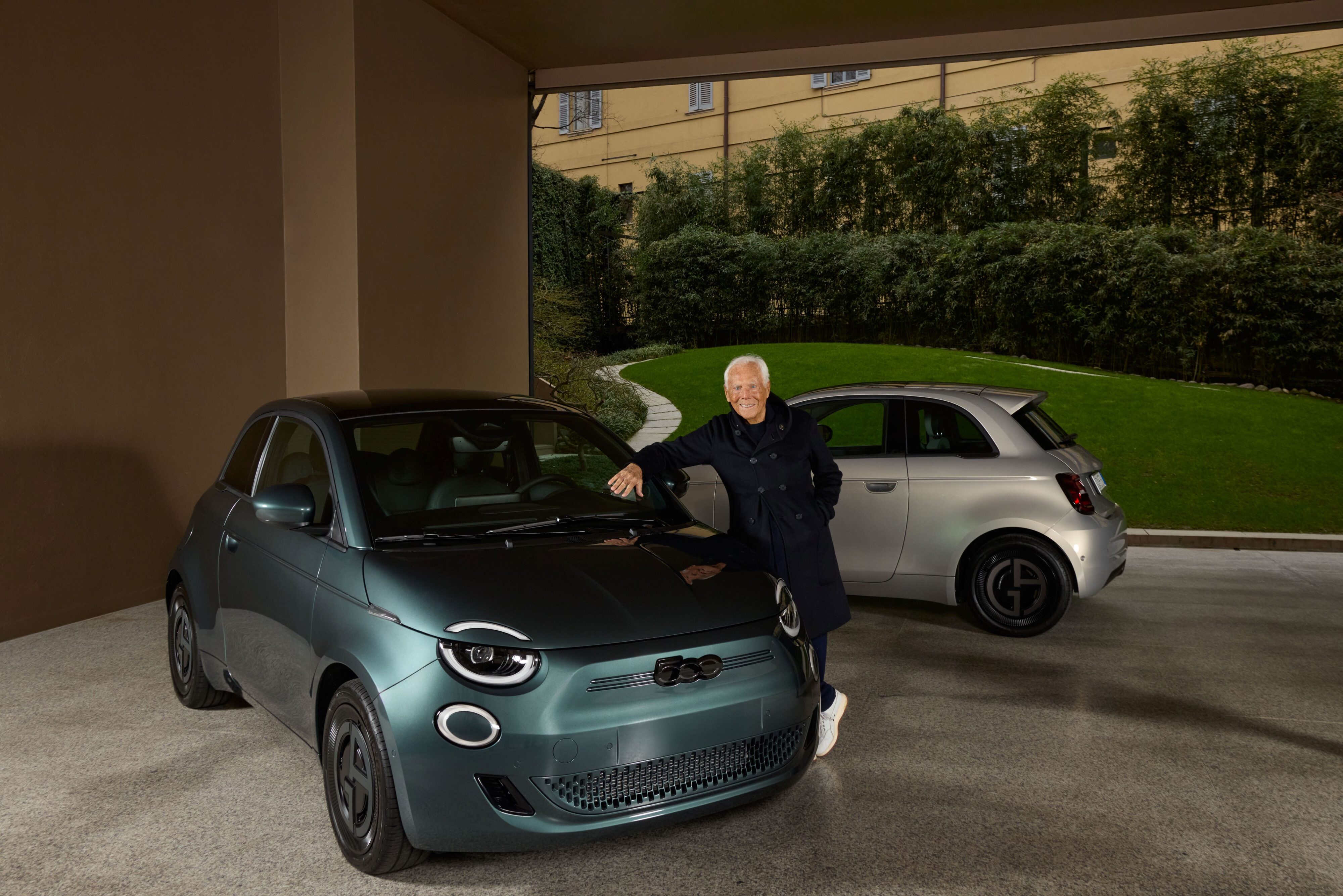 John Elkann, Olivier Francois and Giorgio Armani pose with a Fiat 500e Giorgio Armani Collector's Edition in Blue.