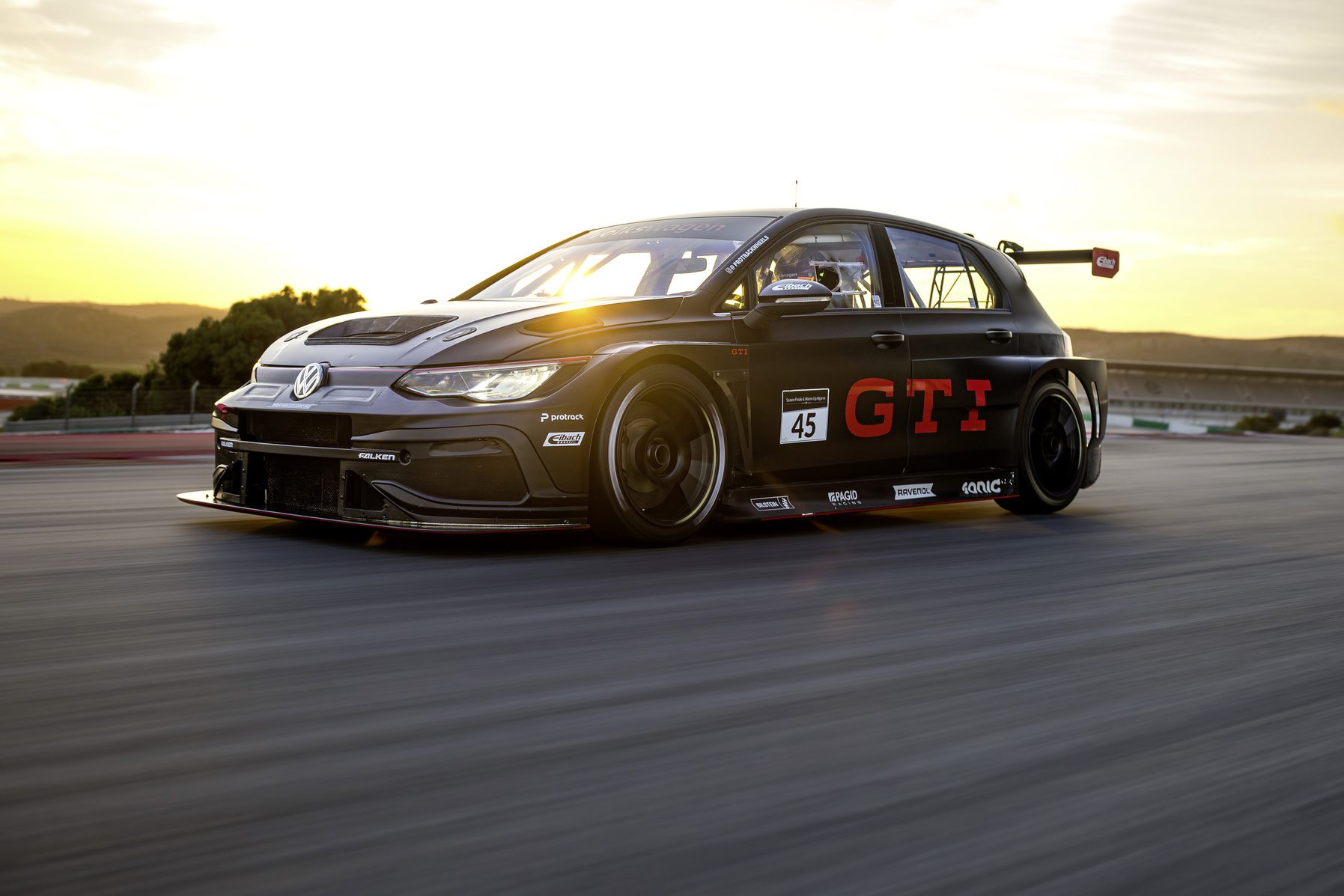 Front three quarters view of a Volkswagen Golf GTI Clubsport 24h in motion on a racetrack.