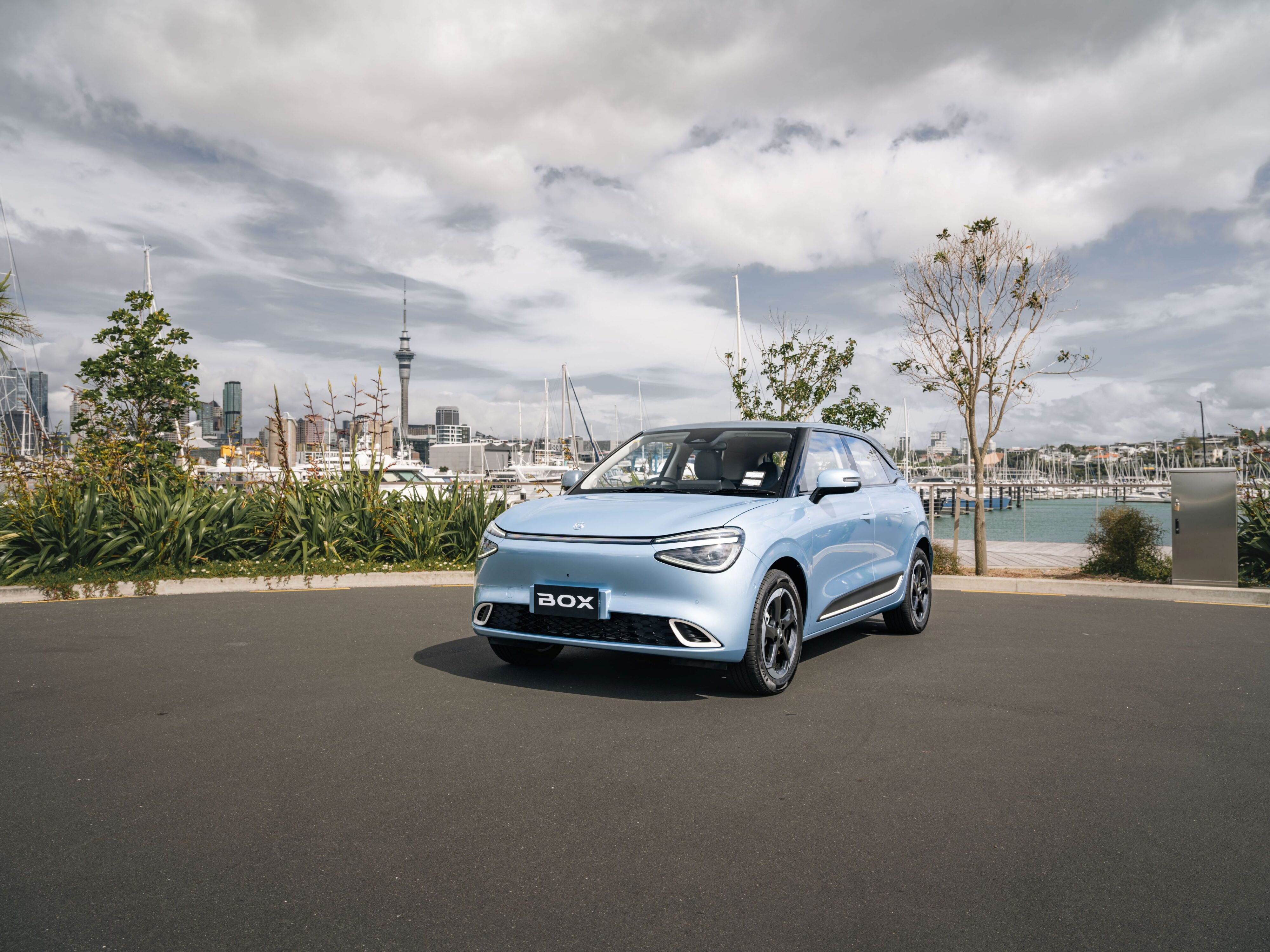 A photo of the new Dongfeng Box with the Auckland skyline in the background.