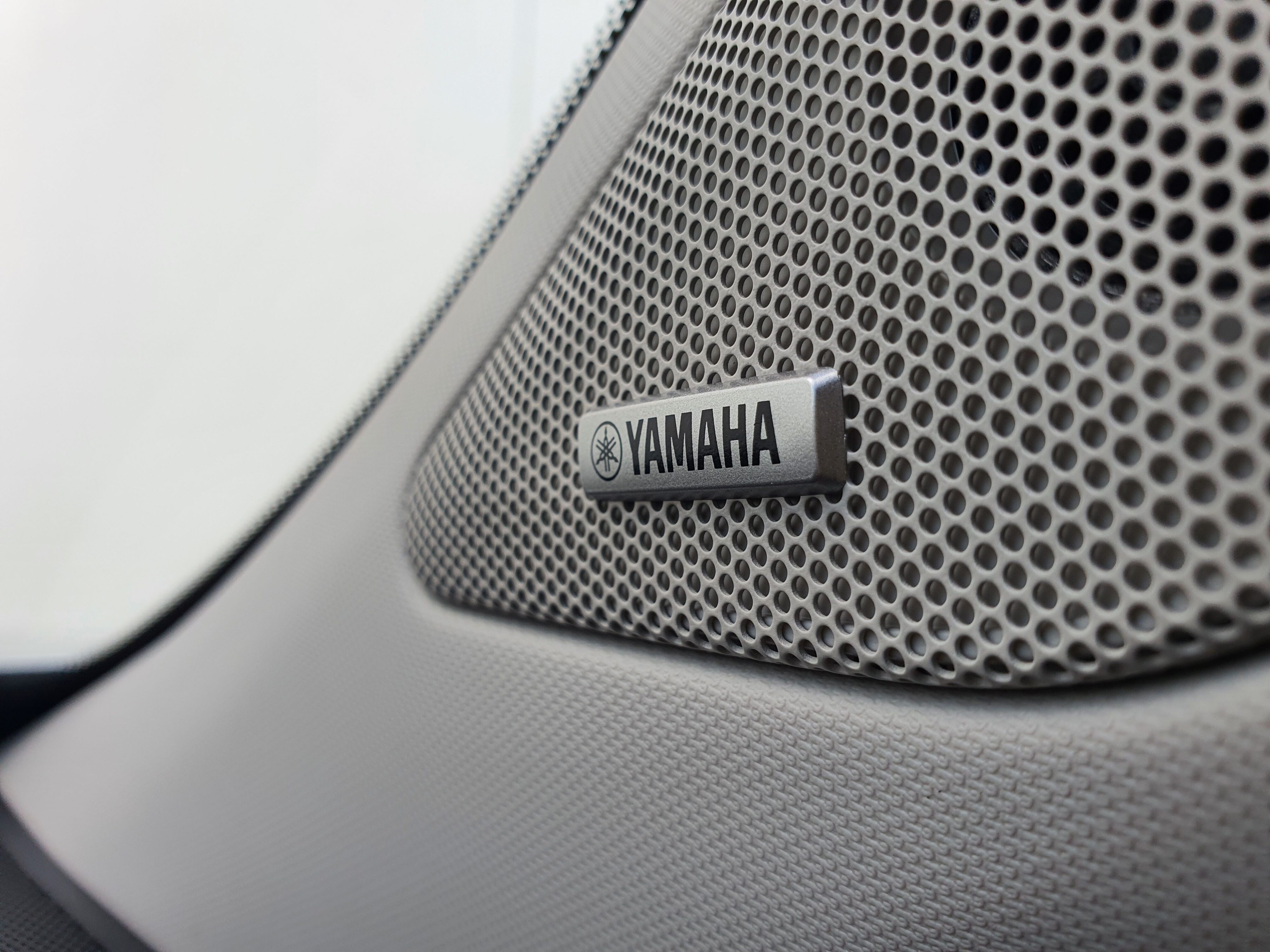 Photo of the Yamaha logo on the speakers on the interior of a 2025 Mitsubishi Outlander VRX PHEV.